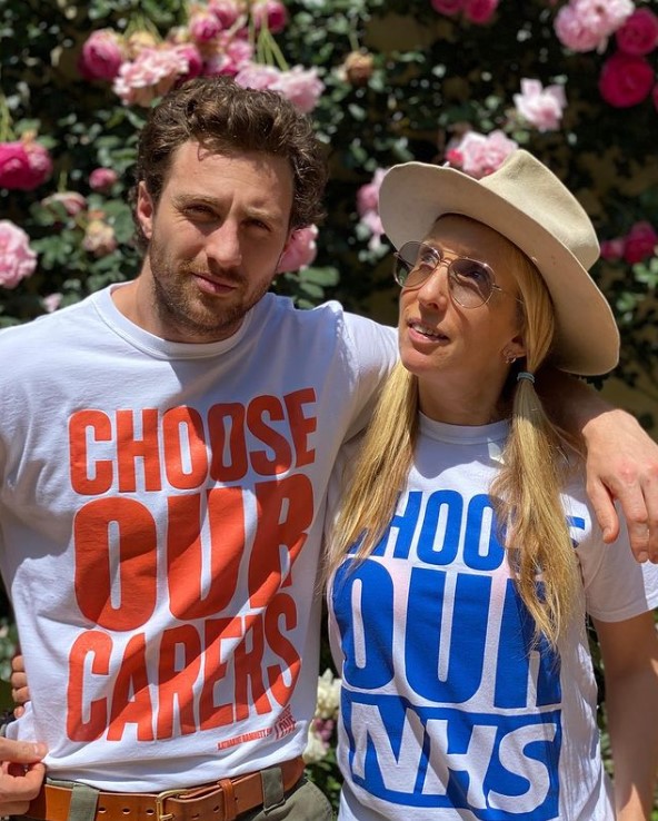 Aaron Taylor-Johnson and Sam Taylor-Johnson wearing white typography t shirt.
