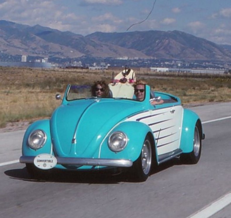 Charity and Dave Kindig in the blue colored modified 67 Chevelle.