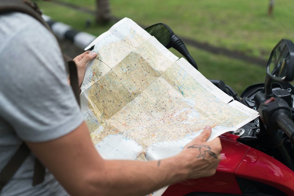 guy looking for a Map for travel 