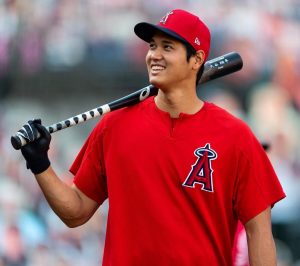 Shohei Ohtani wearing Red Jersey and holding Baseball Slugger