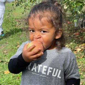 Aalam Khaled eating an apple