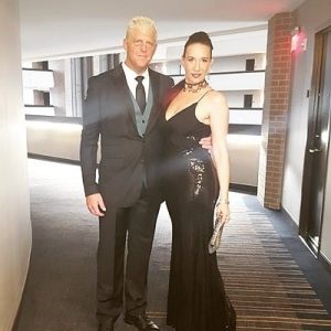 Ta-rel with her husband Dustin Rhodes wearing black dress