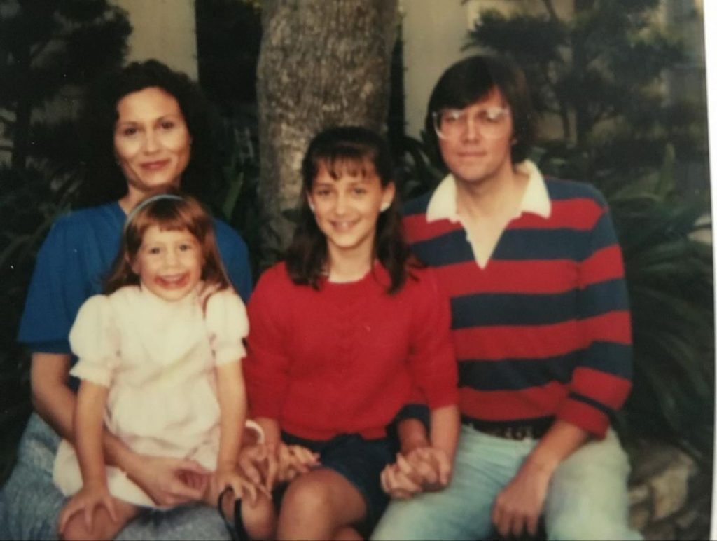 Delle with her husband and daughters