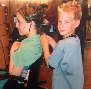 Brad providing hair services at the age of six
