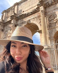 Olivia Rademann taking selfie wearing a hat