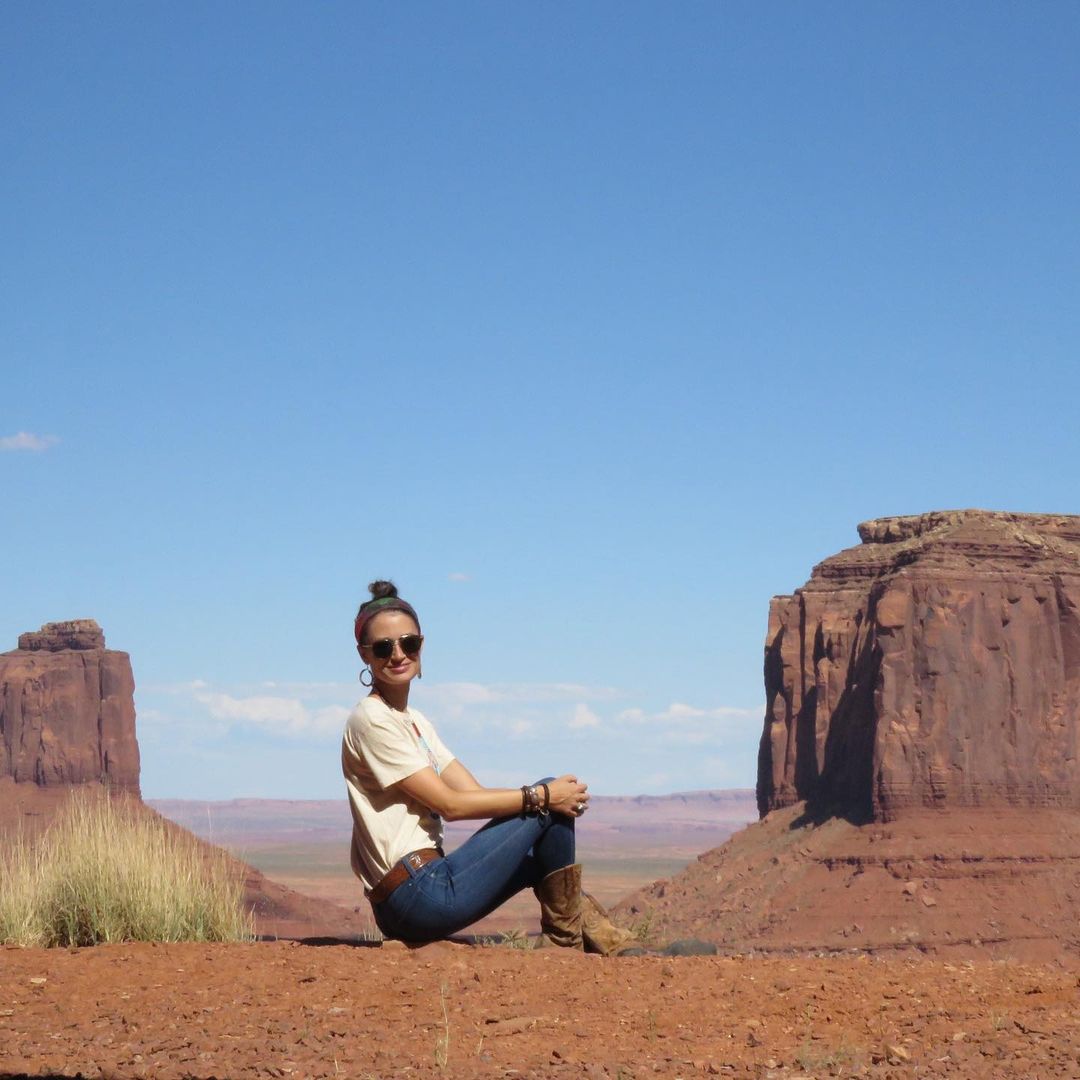 Morgan Petty posing wearing blue jeans and basic top