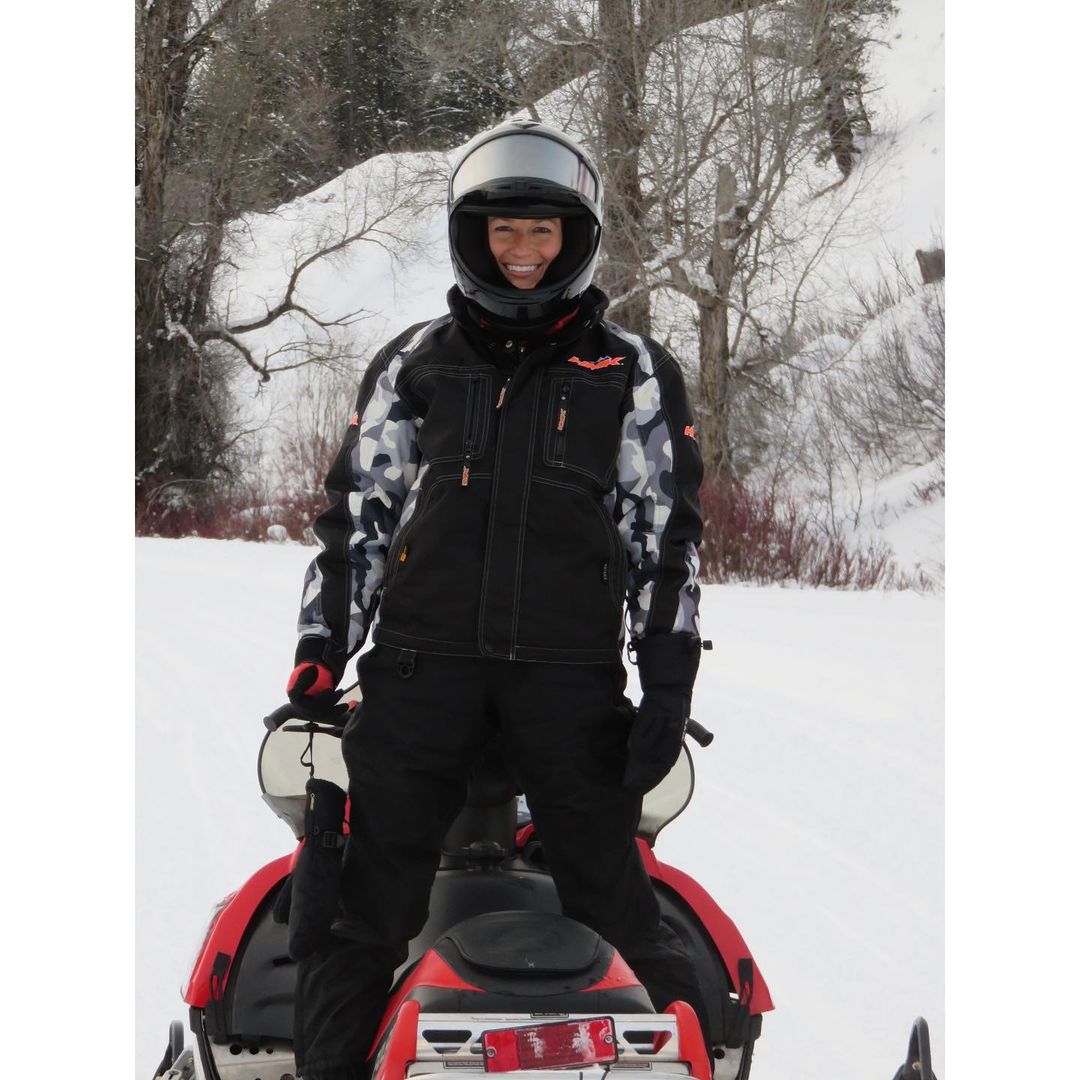 Morgan posing on snow vehicle