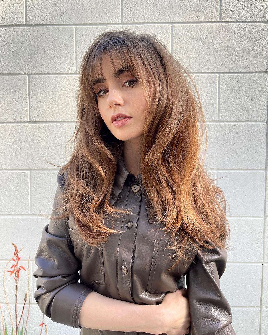 Lily Collins in a haircut with Bangs