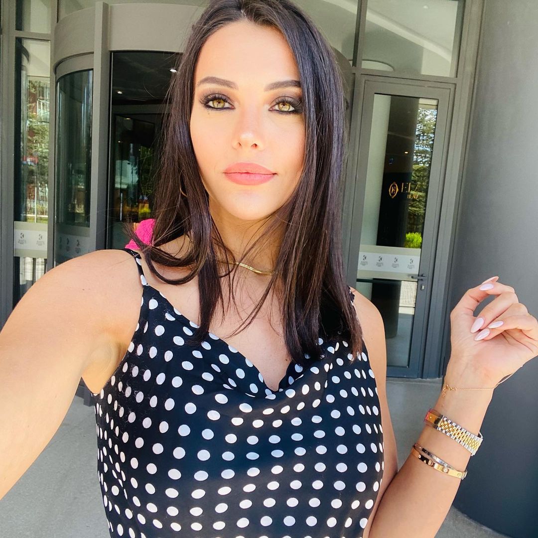 Tuvana taking a selfie in a polka dotted dress