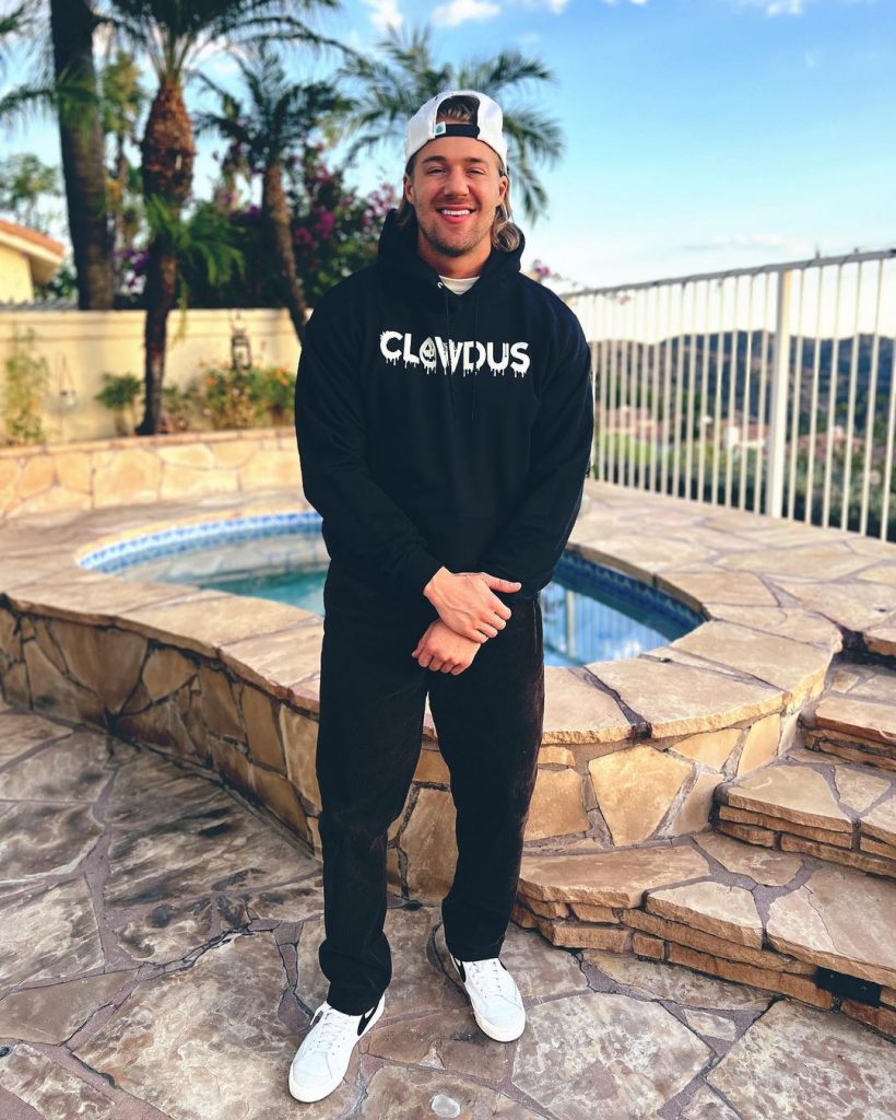 Clowdus wearing his brand's clothing