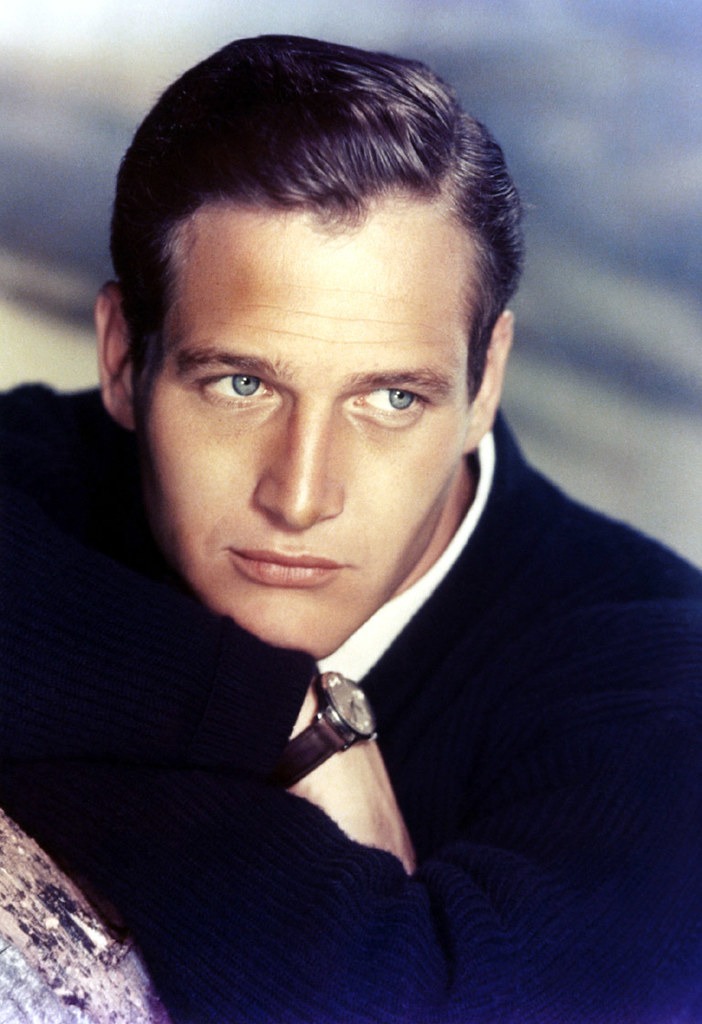 Paul Newman wearing a black coat