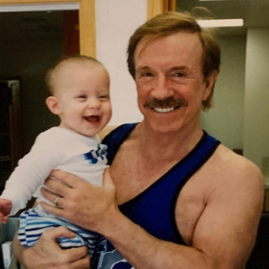 Childhood photo of Dakota Norris with his father Chuck Norris.