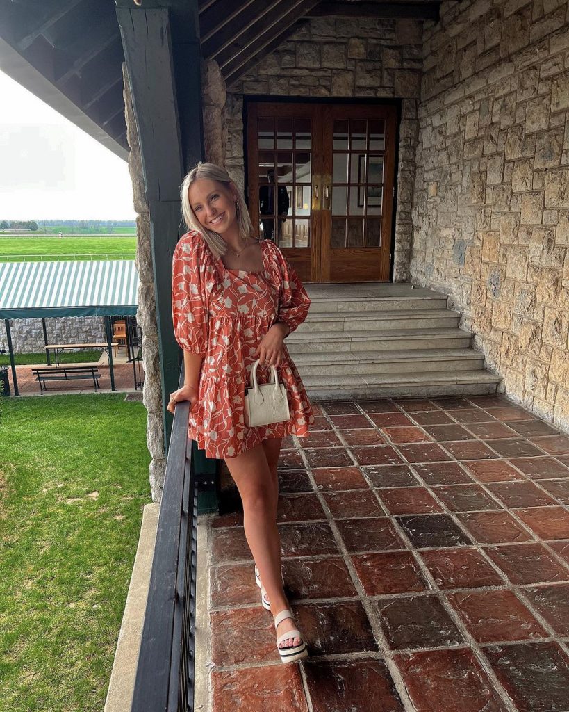 Harper Hempel wearing a red floral dress