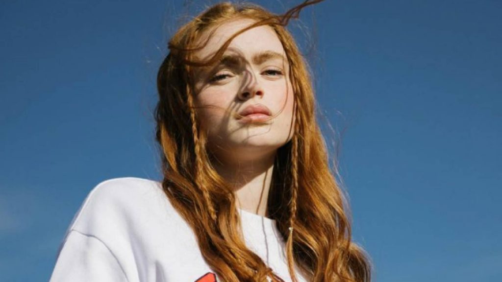 Sadie Sink wearing a white top