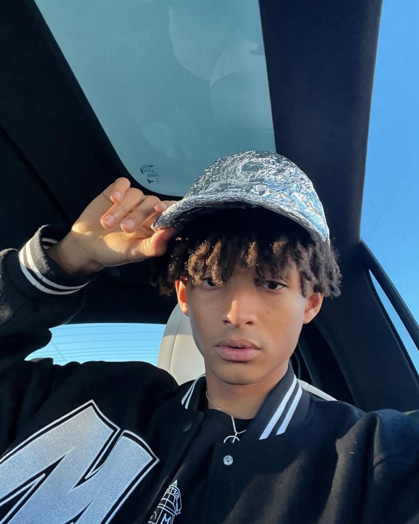 Jaden taking a selfie wearing a hat.