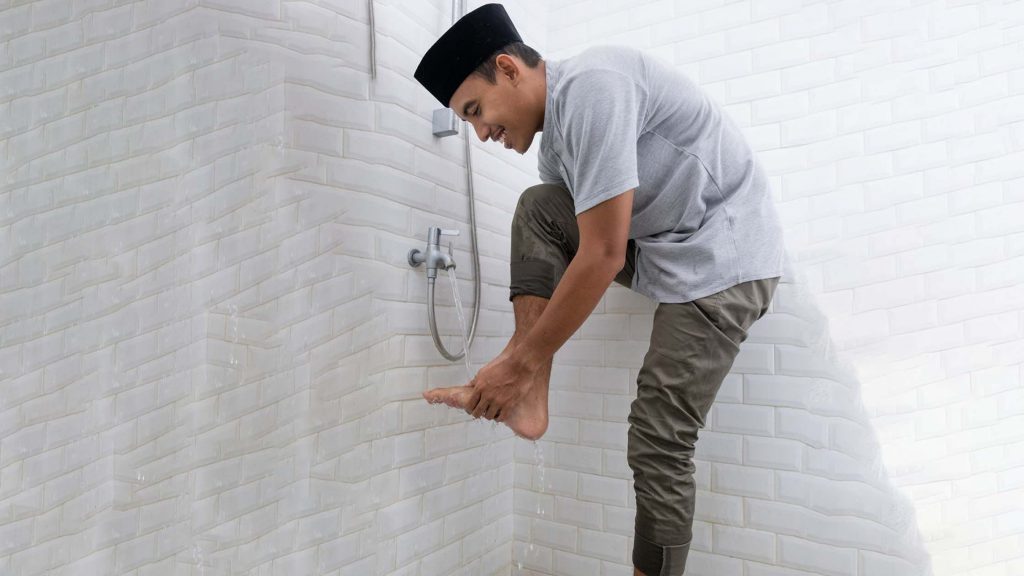 A man washing his feet.