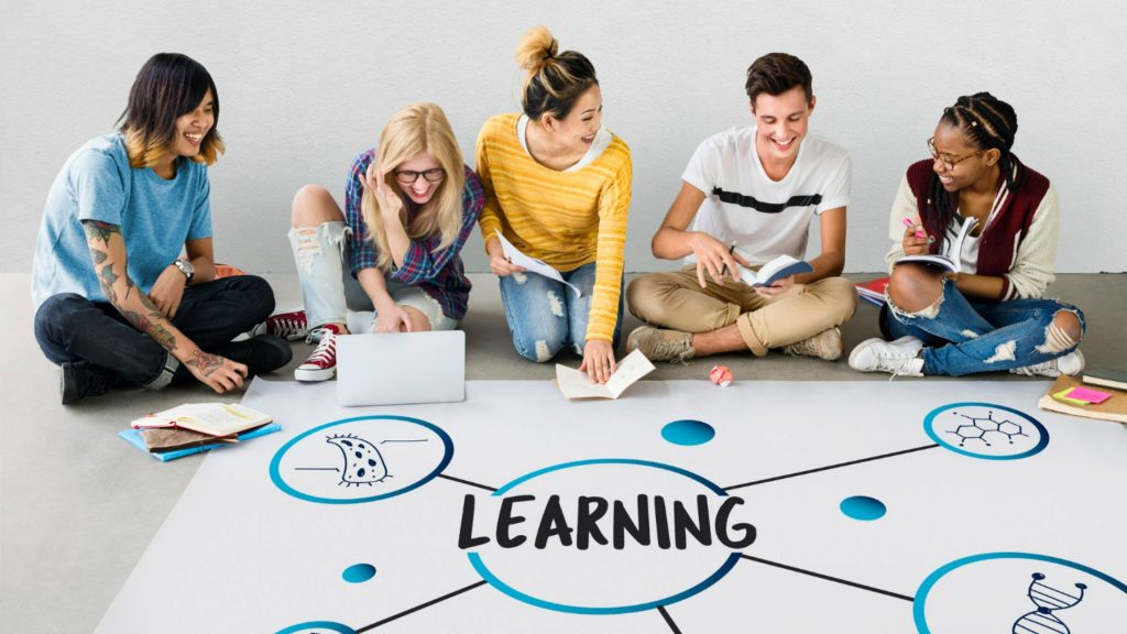 A group of people sitting together to add new learnings to their personality.