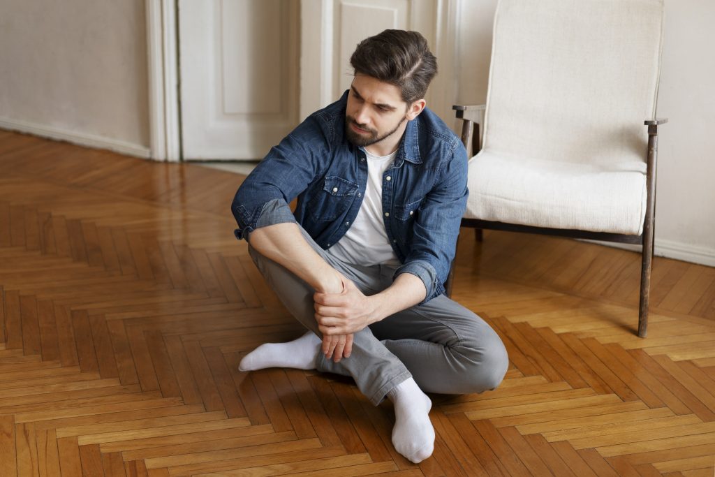 A man wearing a clean pair of white socks.