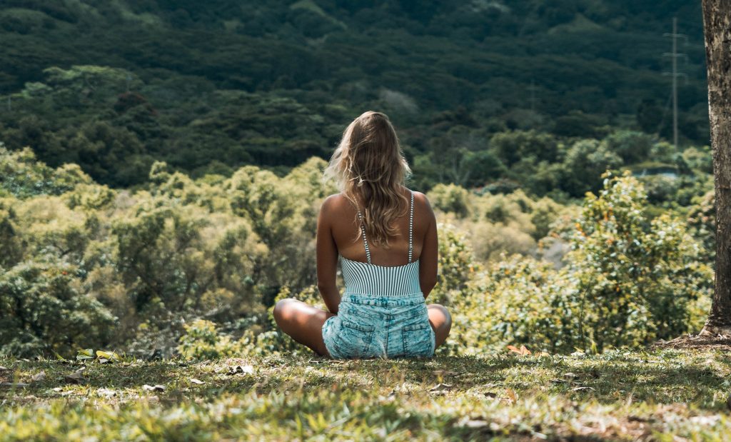 A girl sitting in the lap of nature.