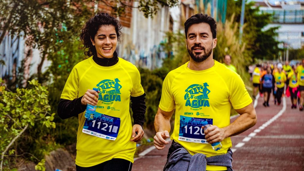 A man and woman running together.