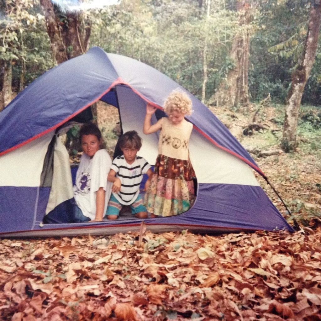 Aisha doing camping with her brither and mother at a young age.