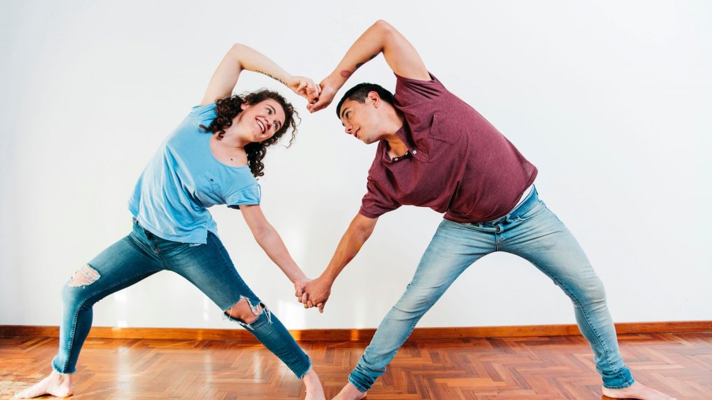 A couple enjoying dance class together.