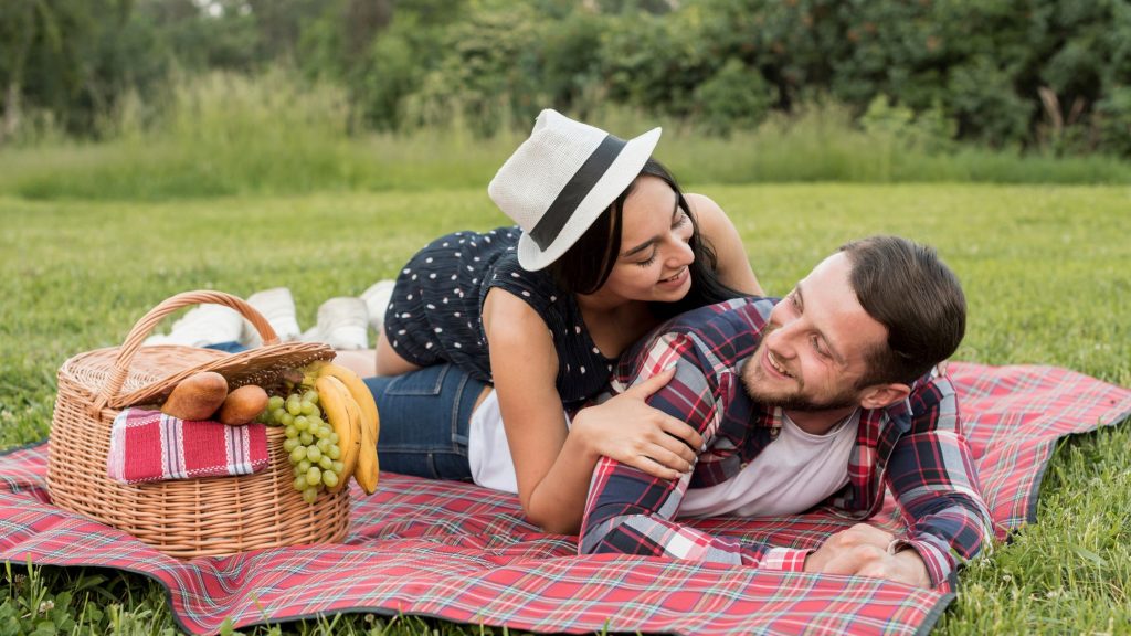 A couple enjoying on a picnic.