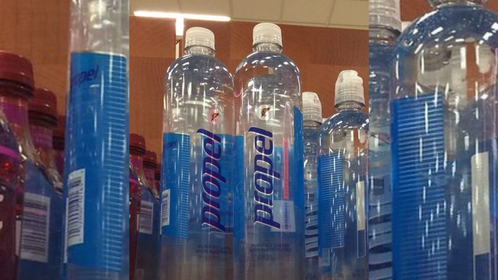 Bottles of Propel Water on a shelf.