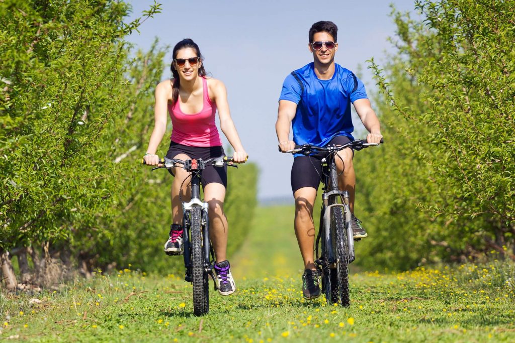 a couple doing cycling together.