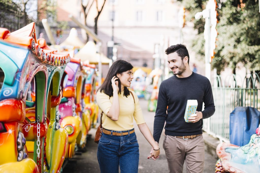 couple-having-walk-theme-park