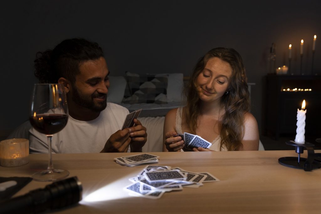 A couple playing card games together